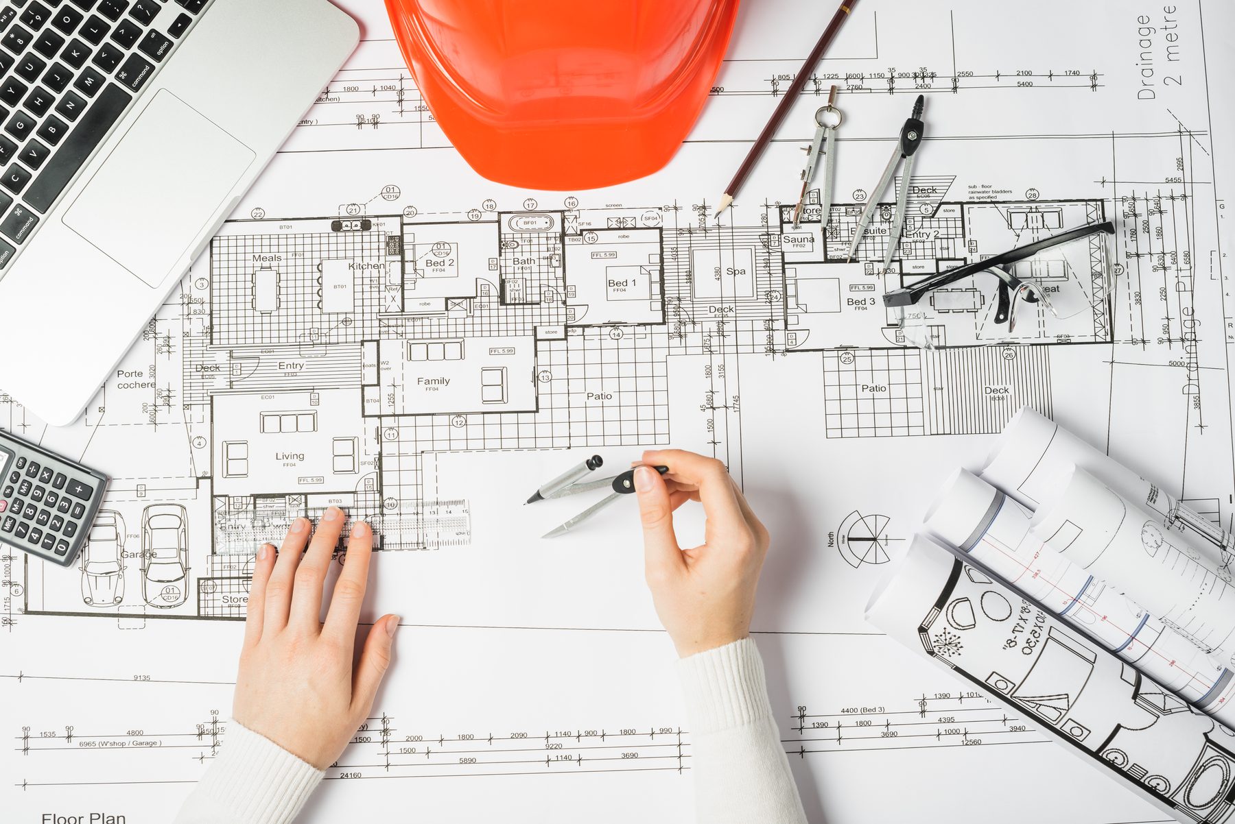 An engineer marking up building services drawings